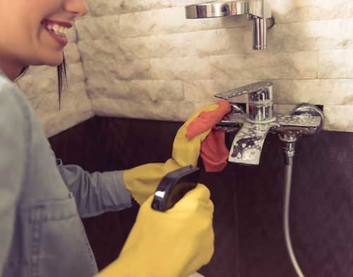 Woman cleaning the home for home cleaning tips blog