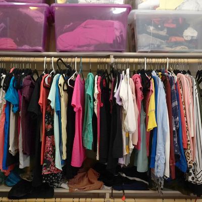 Closet filled with clothes for money saving tips for clothes blog post